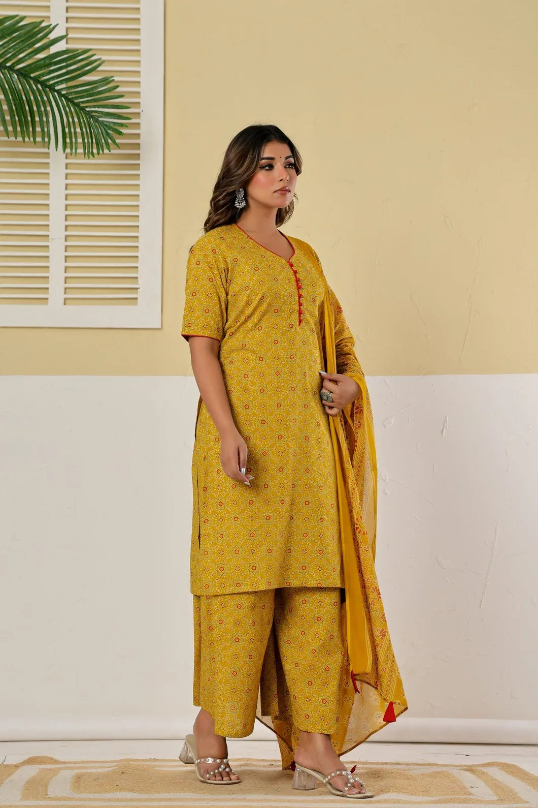 Woman wearing mustard yellow kurta palazzo set styled with dupatta - YAVASTRAH