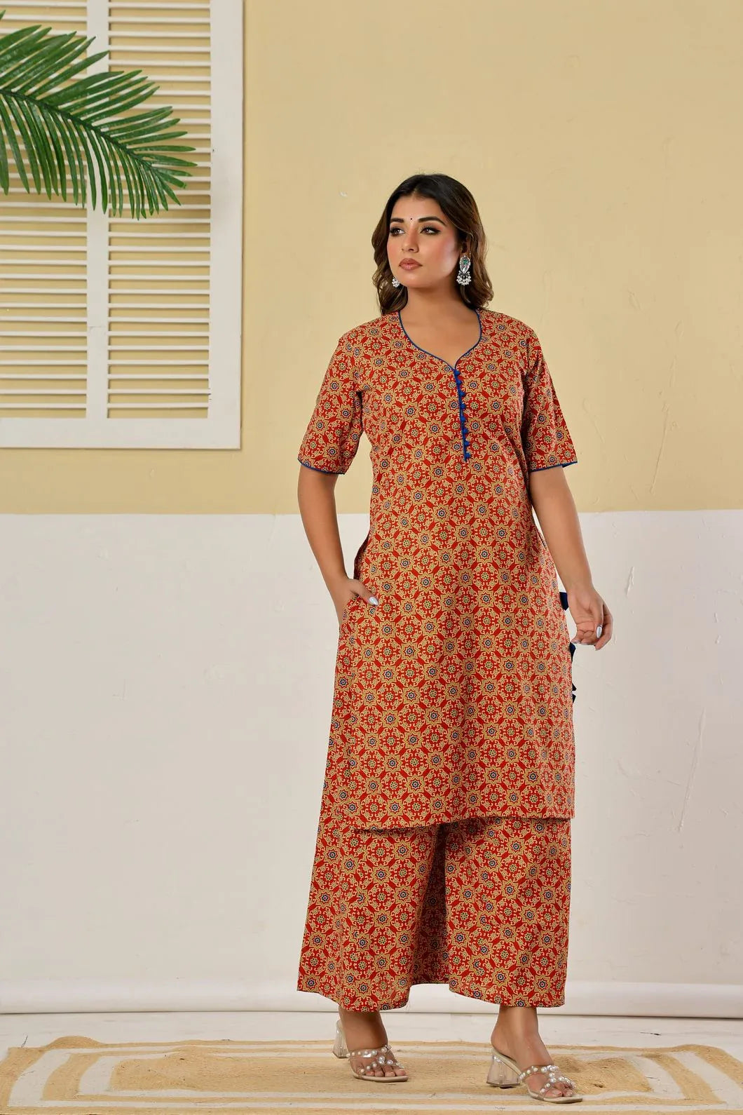 Close-up of ethnic motif print detail on red kurta - YAVASTRAH
