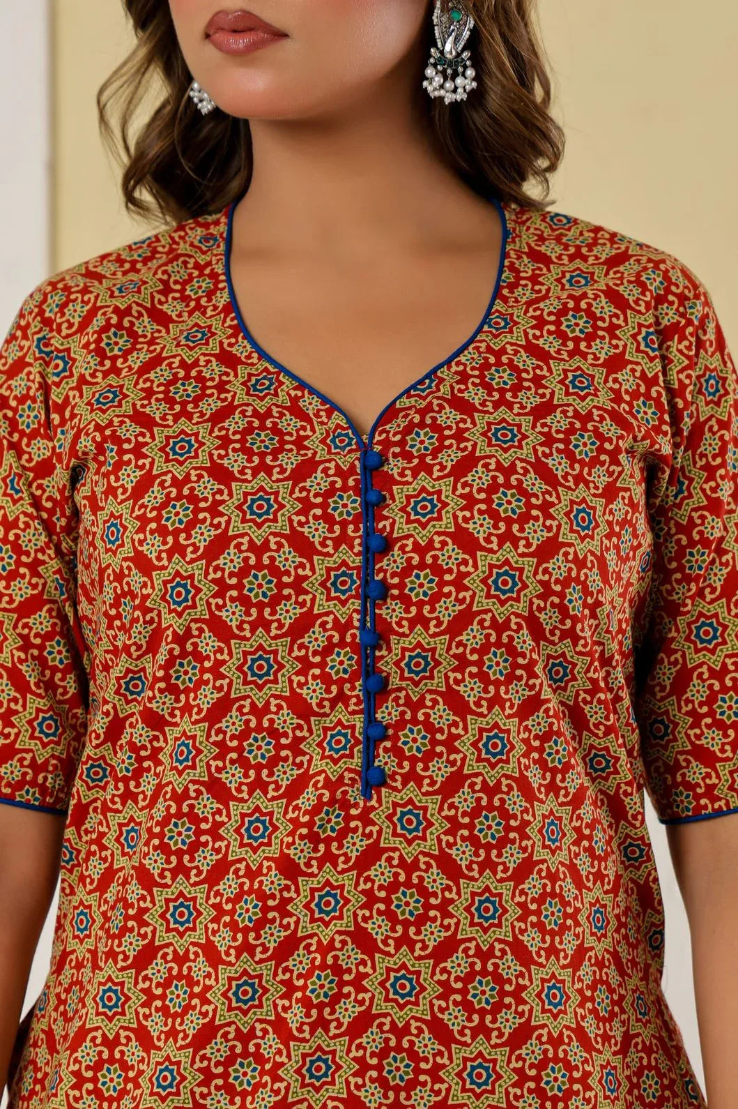 Woman in red printed kurta set, close-up of neckline detail - YAVASTRAH
