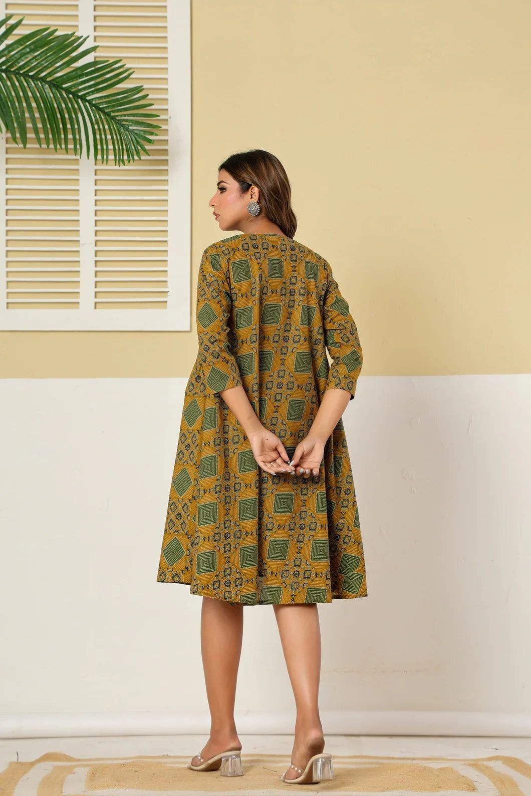 Mustard green A-line flare dress back view with floral print - YAVASTRAH