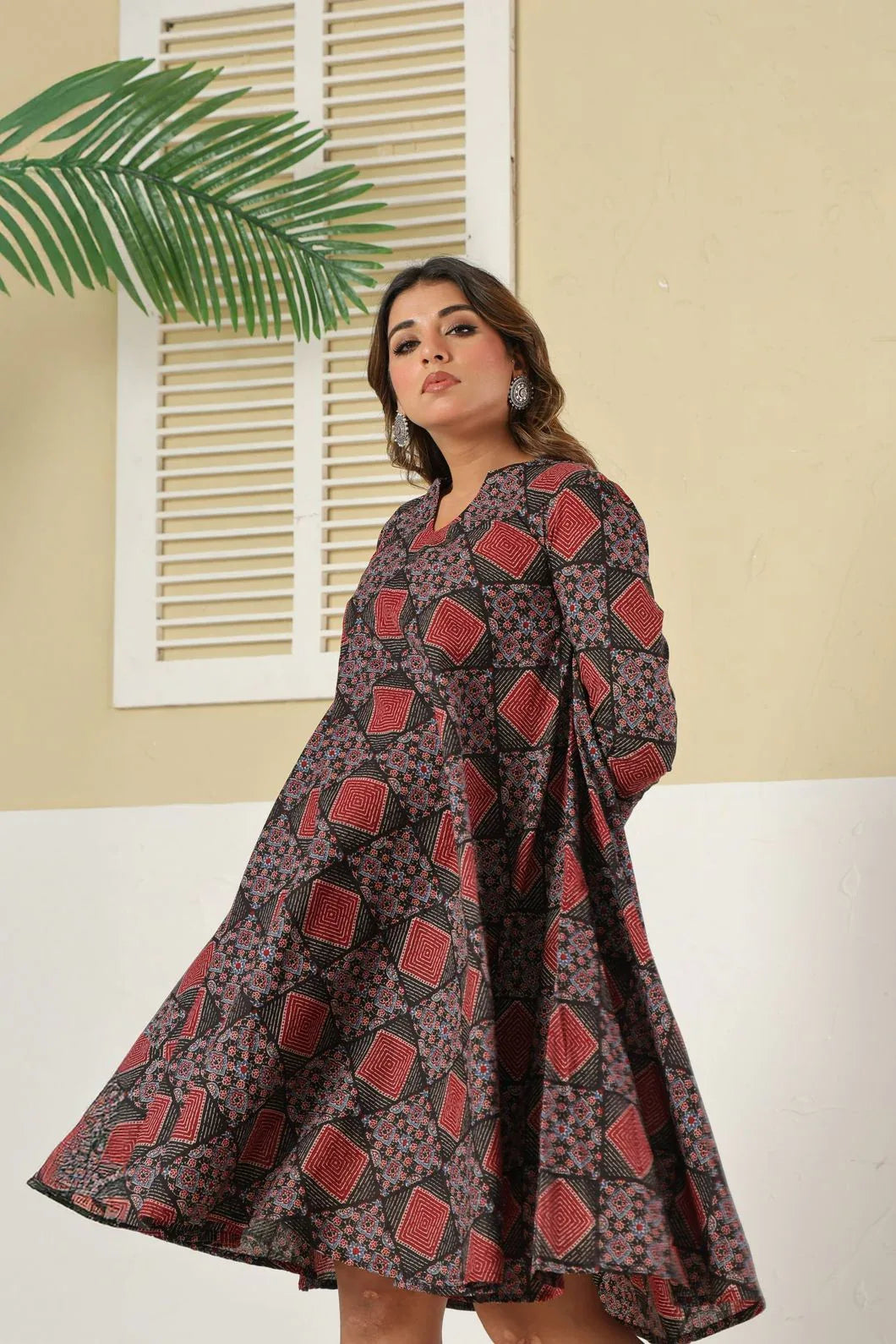 Maroon black geometric A-line dress close-up of flared hem - YAVASTRAH
