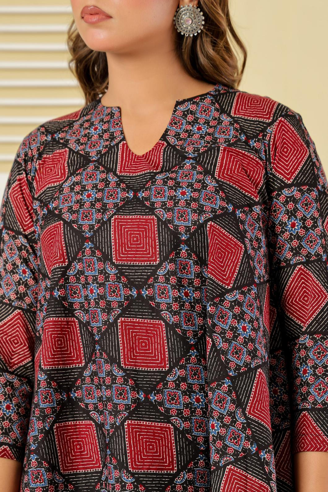 Close-up of geometric print detail on maroon and black A-line dress - YAVASTRAH
