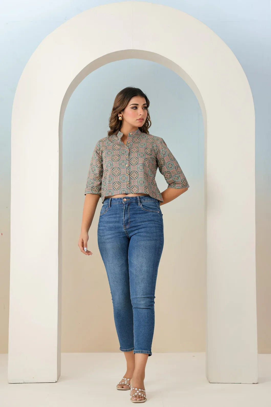 Woman wearing a teal green multicolor ethnic motif print crop top, front view - YAVASTRAH
