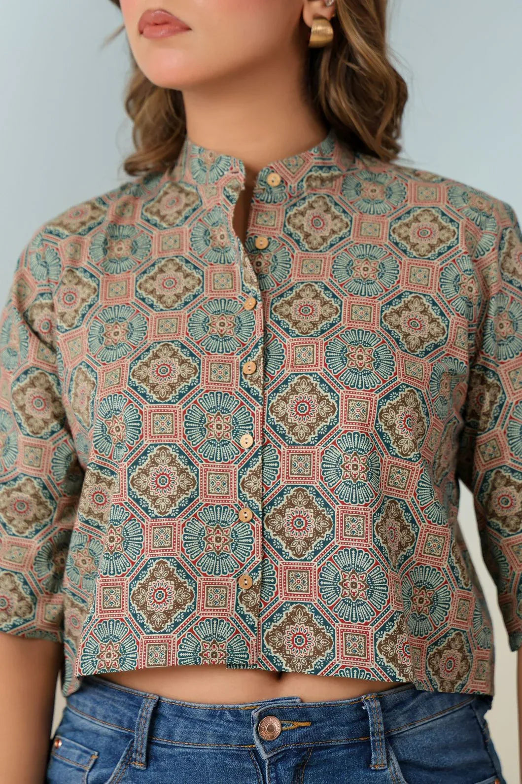 Close-up of multicolor ethnic motif print on teal green crop top - YAVASTRAH
