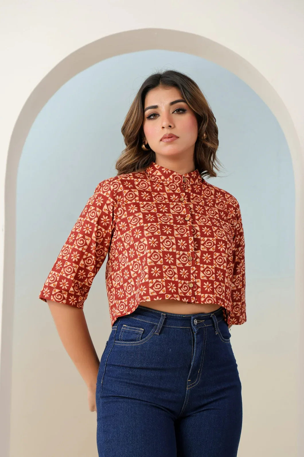 Close-up of ethnic motif print detail on rust red crop top - YAVASTRAH
