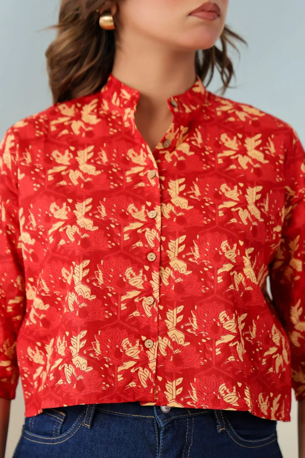 Close-up of floral ethnic motif print detail on red crop top - YAVASTRAH