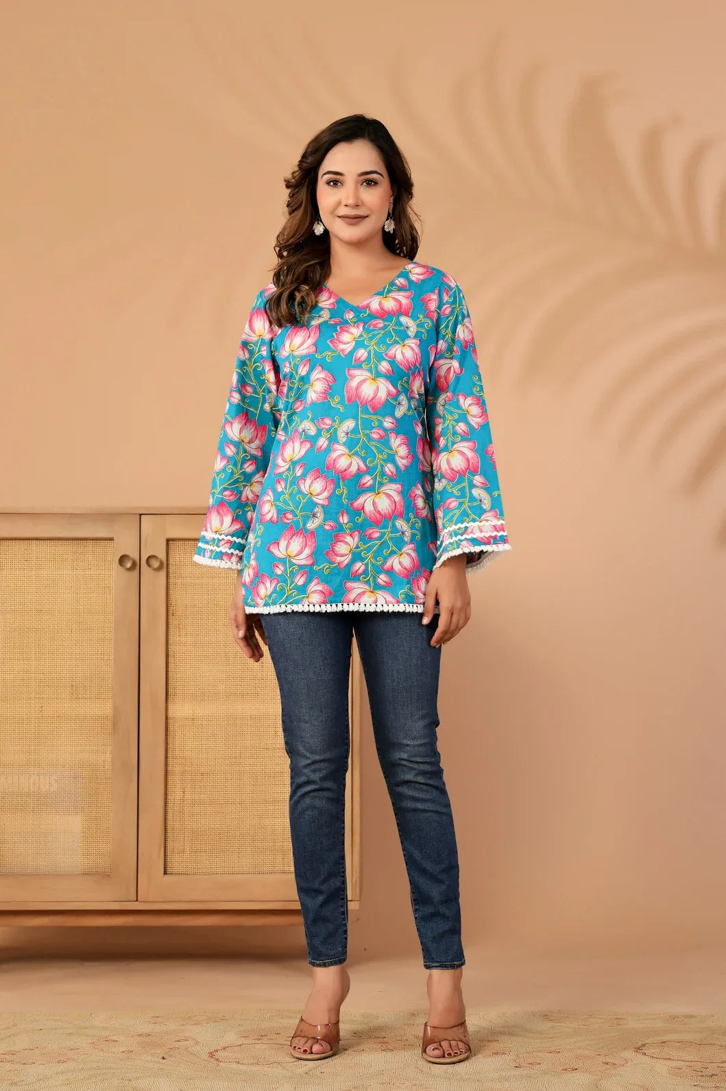 Woman in teal blue floral kurti, full length view - YAVASTRAH
