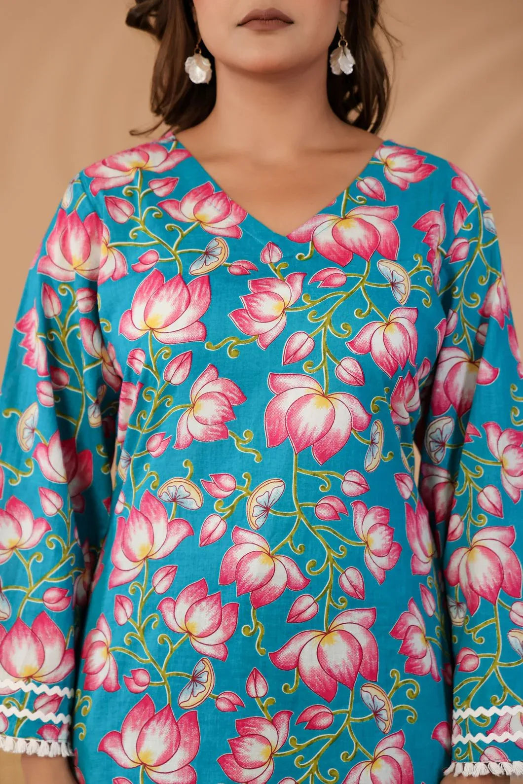 Close-up of floral print detail on teal blue cotton kurti - YAVASTRAH
