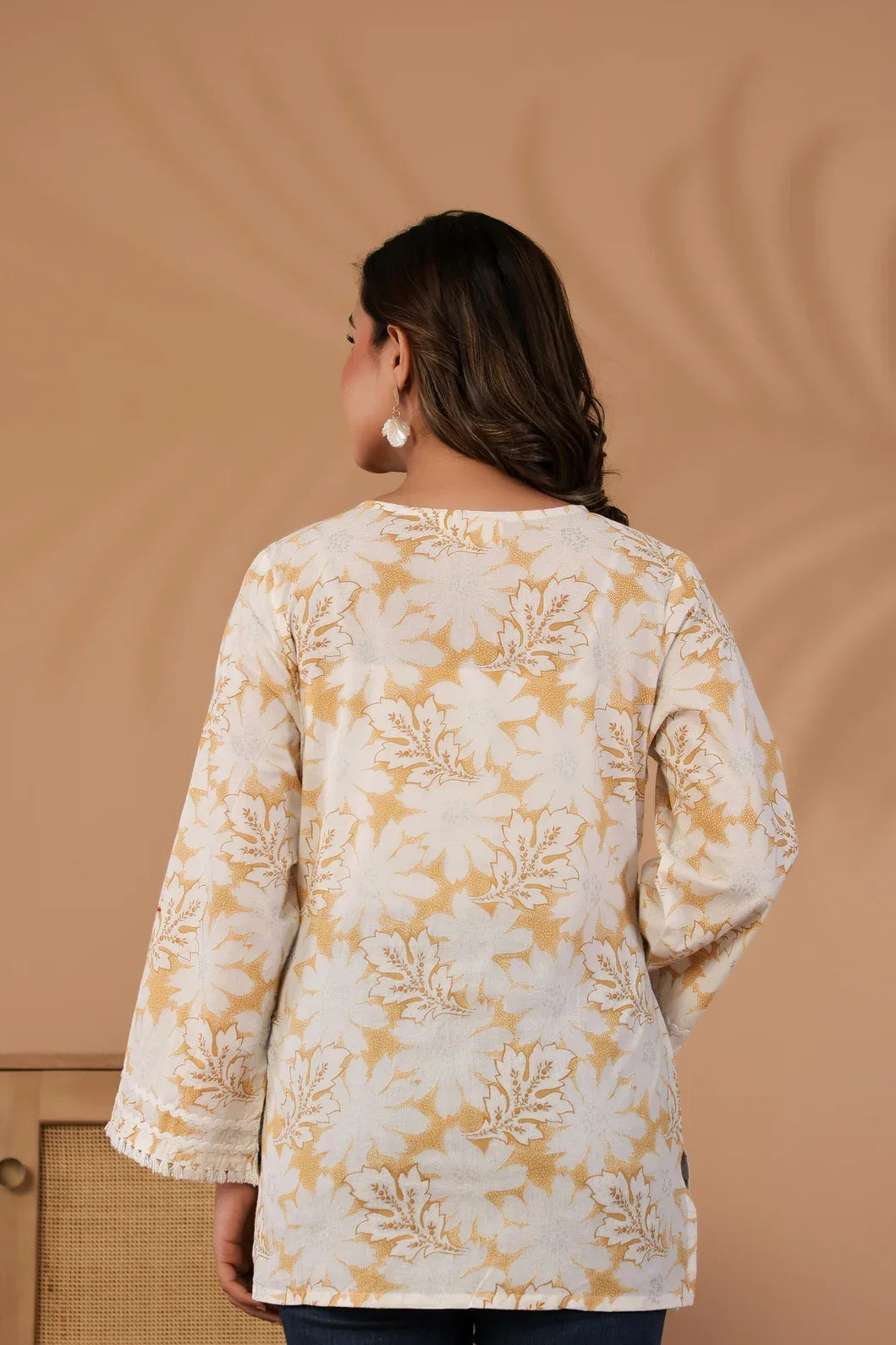 Back view of floral print detail on ivory and mustard cotton kurti - YAVASTRAH