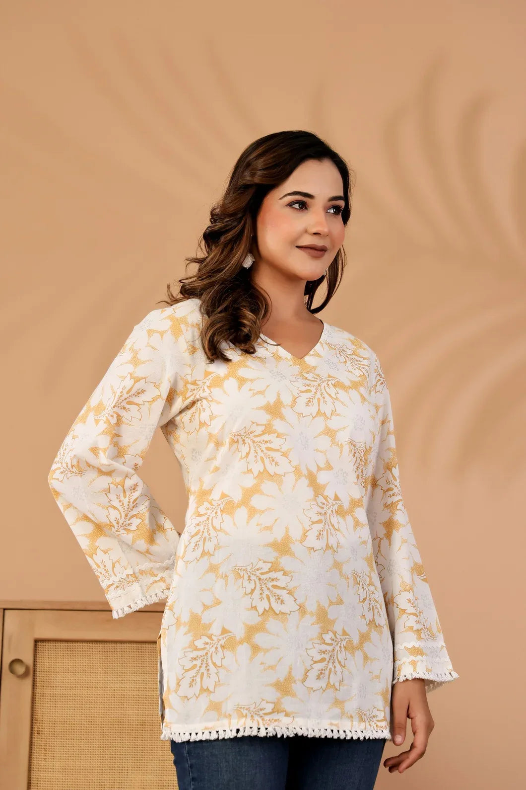 Woman in ivory and mustard floral kurti, full length view - YAVASTRAH
