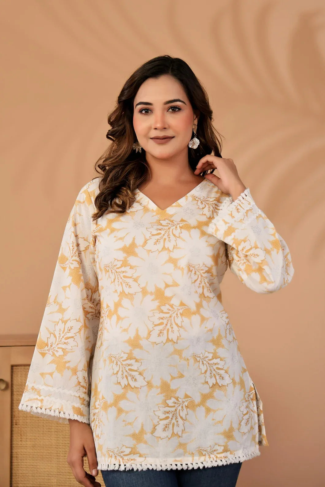 Close-up of floral print detail on ivory and mustard cotton kurti - YAVASTRAH
