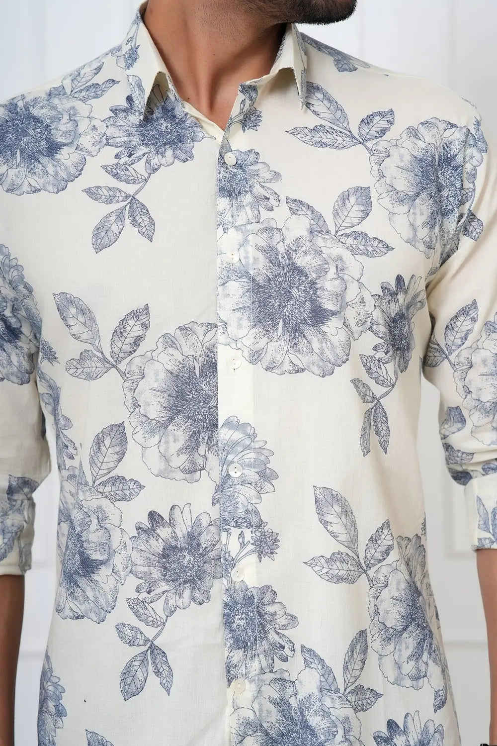 White shirt with blue floral pattern worn by a person
