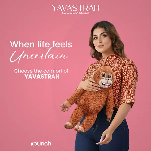 Woman holding a plush toy with text about Yavastrah on a pink background